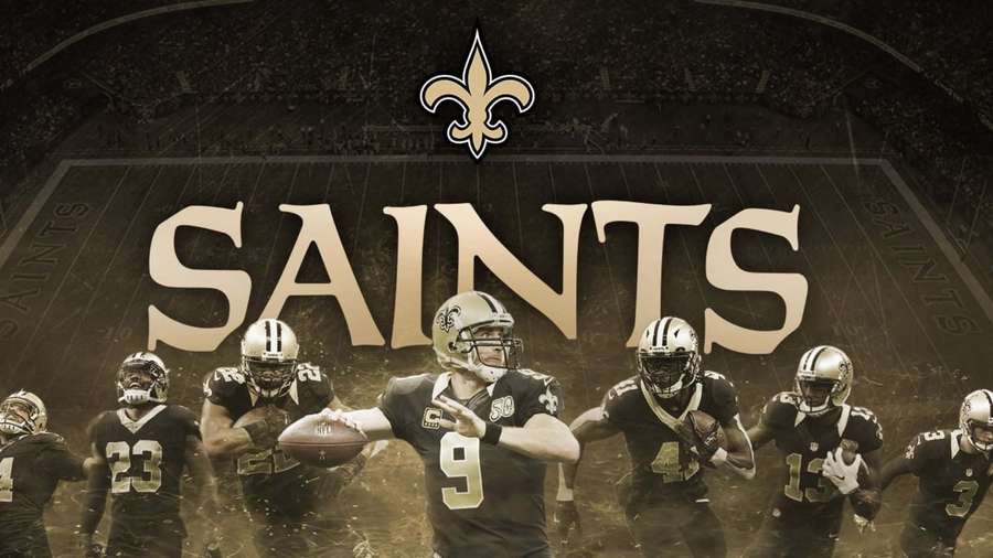 New Orleans Saints football team players in action on the field with team logo and name. — Saints Background