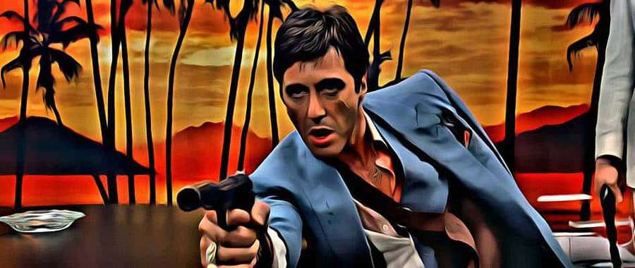 Man in blue suit aiming gun at sunset with palm trees — Scarface Picture