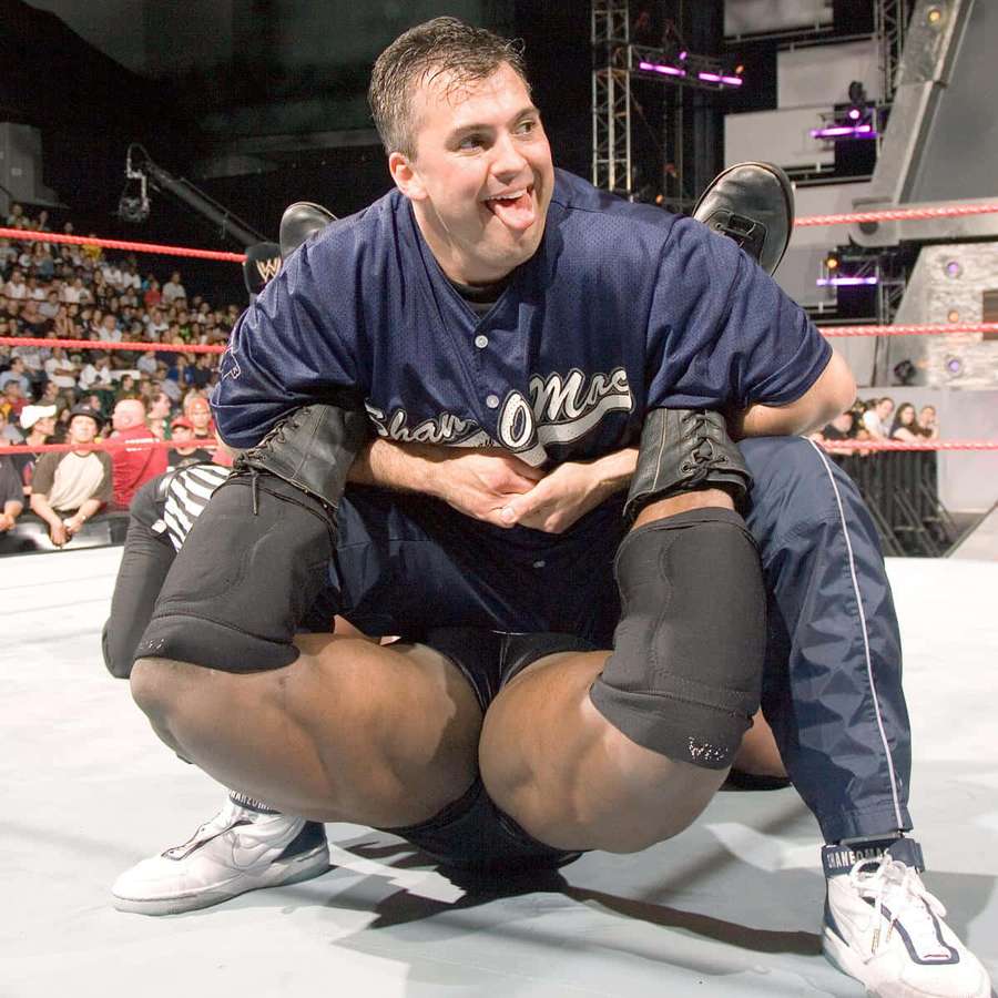 Wrestler crouching in ring sticking out tongue to crowd — Shane Mcmahon Wallpaper