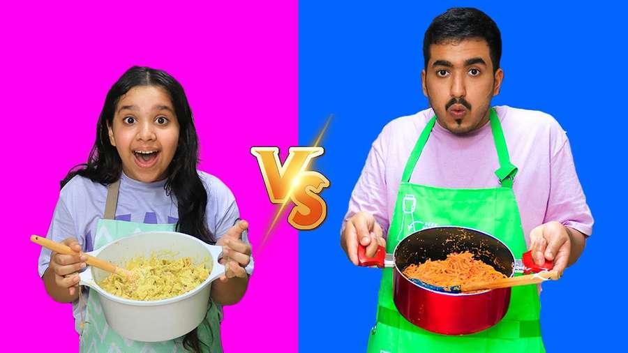 Two people holding pots of pasta with shocked faces in a food challenge. — Shfa Picture