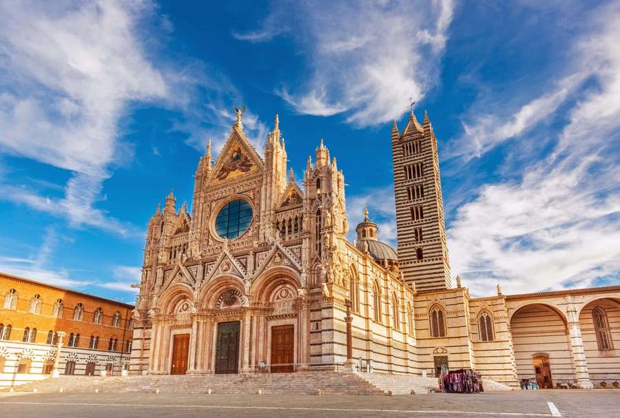 Gothic cathedral with striped bell tower under bright blue sky — Siena Cathedral Wallpaper