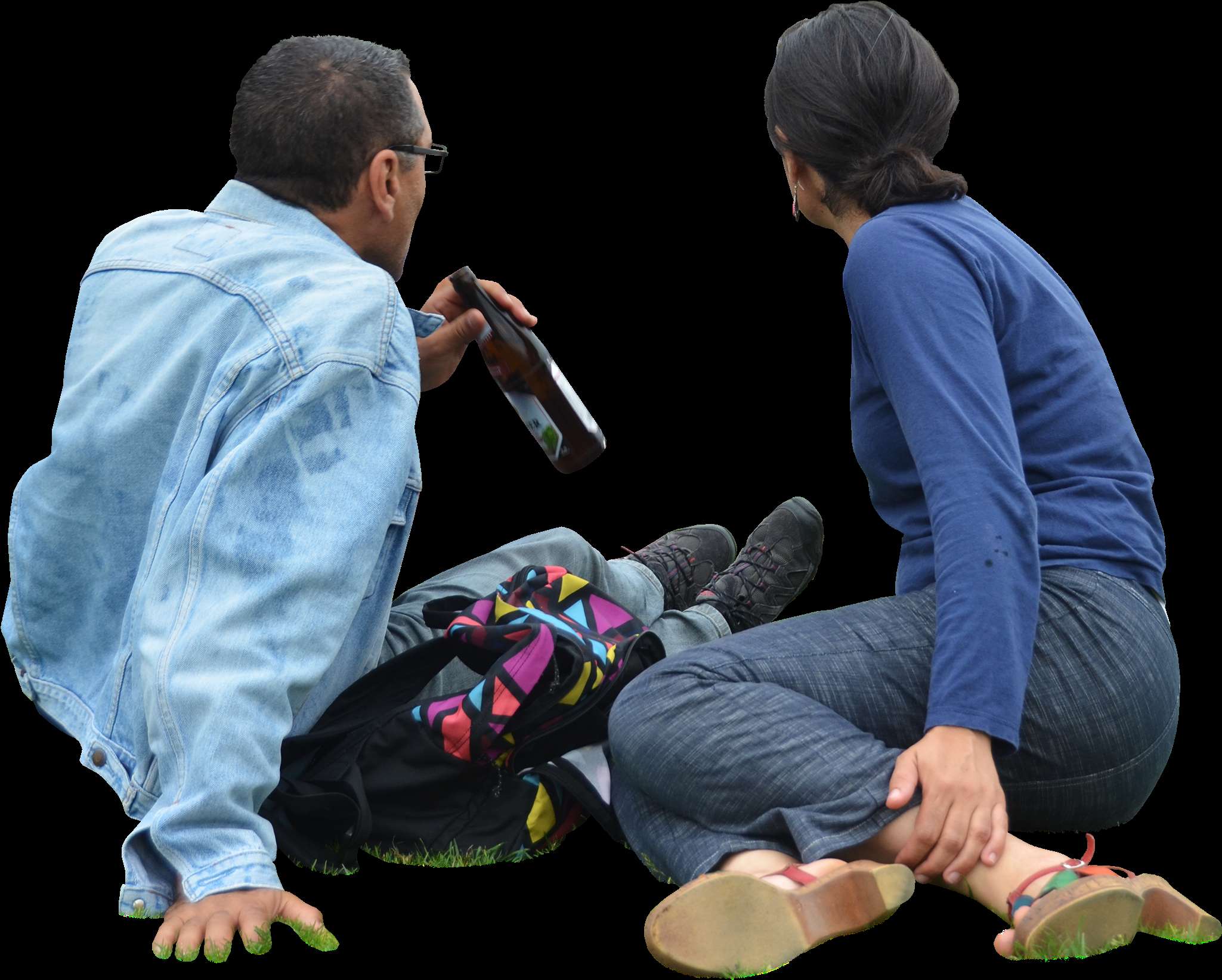 Two casually dressed people sitting on grass one drinking beer the other looking on — Sit down Picture