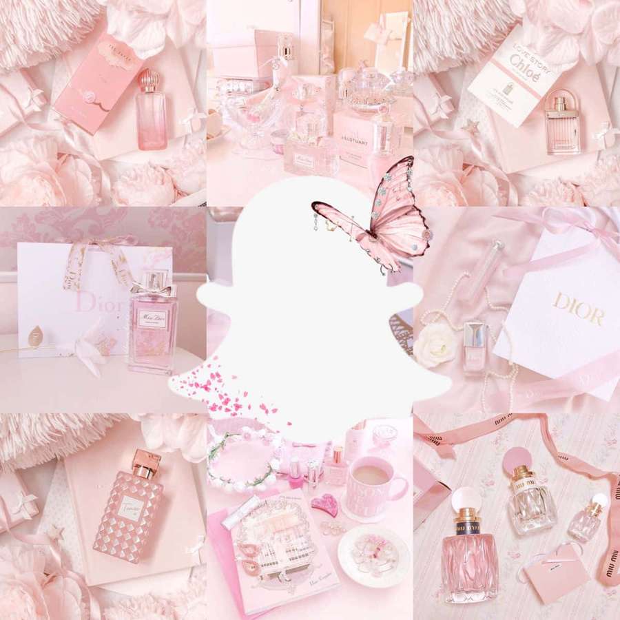 Pink luxury perfume and beauty products arranged with butterflies and fluffy textures. — Snap Picture