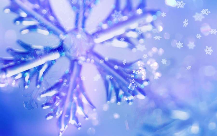 A glowing blue snowflake with bokeh lights and floating snowflakes in a purple background. — Snowflake Background