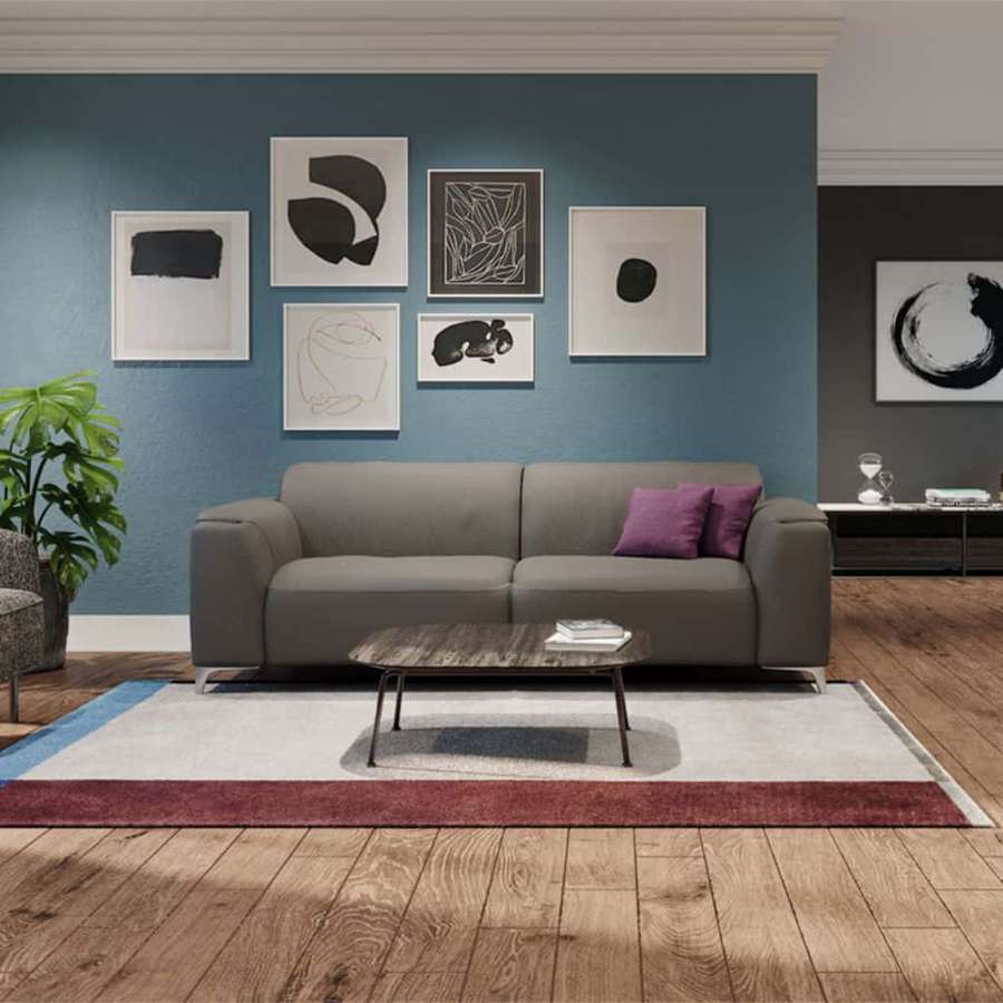 Graues Sofa mit lila Kissen in modernem Wohnzimmer mit abstrakter Kunst und Holzböden. — Sofa Bilder