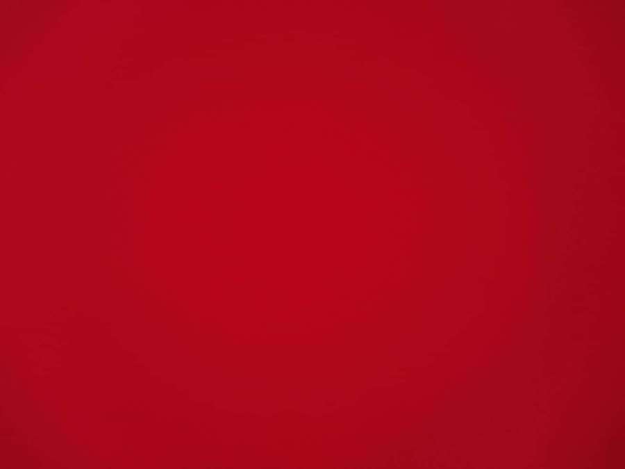 Solid red gradient background with subtle tonal variations. — Solid Red Background