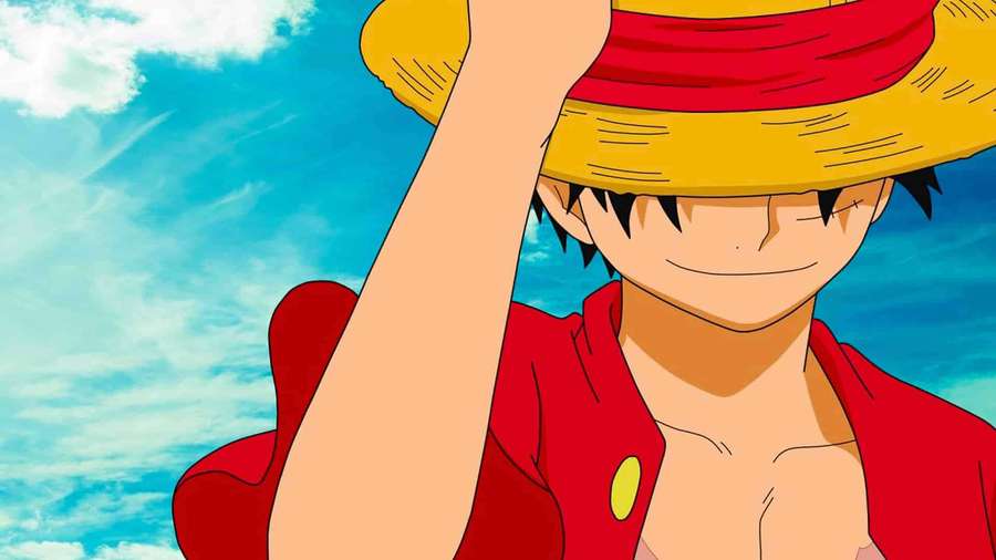 Personaje anime con sombrero de paja sonriendo bajo el cielo azul — Sonrisa de Luffy Fondos de pantalla