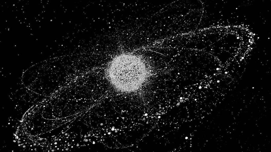 Abstract cosmic scene with central star and swirling particle trails. — Space Debris Wallpaper