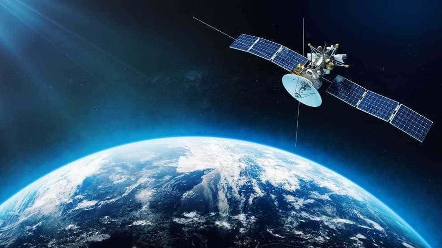 Satellite orbiting Earth showing blue oceans and white clouds in deep space. — Space Satellite Picture