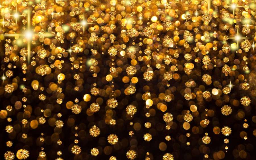 Golden sparkles and bokeh lights falling like confetti against a dark backdrop. — Sparkly Picture