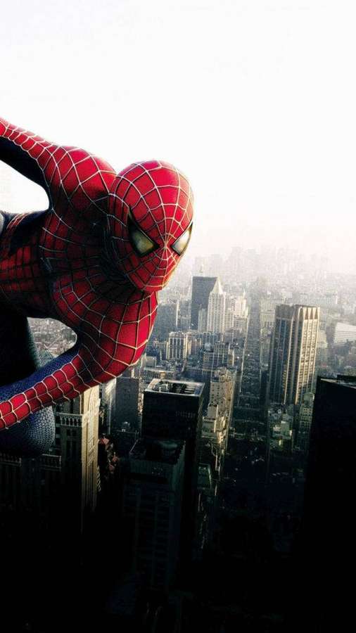 Spider-Man swinging over a city skyline at dusk. — Spider Man iPhone Wallpaper