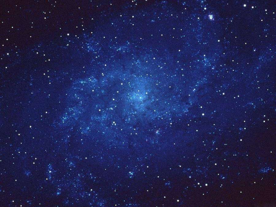 A vibrant blue nebula filled with stars in deep space. — Starry Sky Background