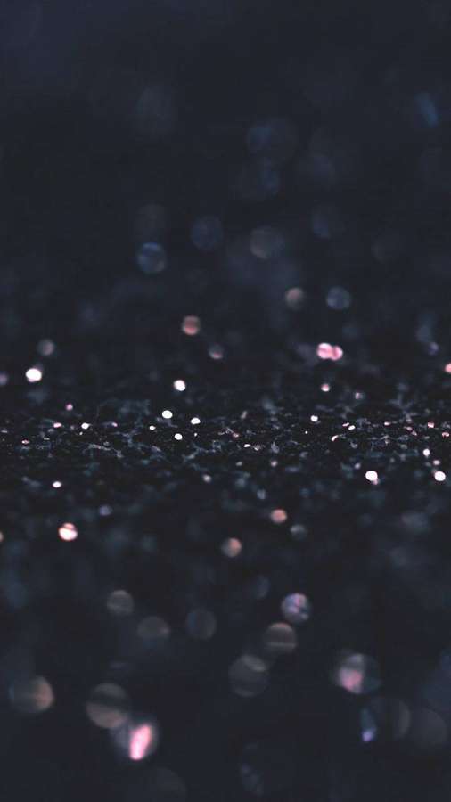 Dark glitter surface with soft pink and blue sparkles and bokeh lights. — Stylish Black Background
