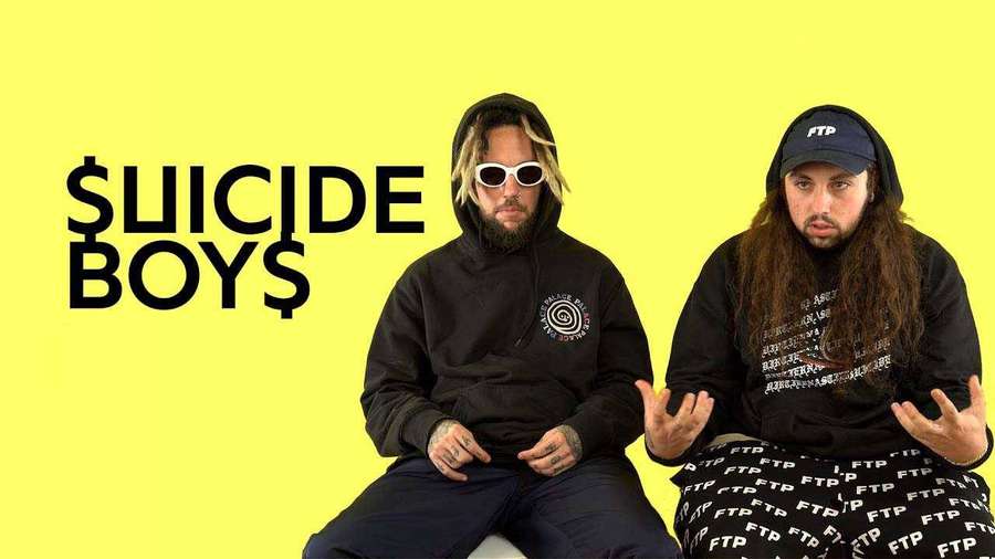 Two men in hoodies and sunglasses pose against a yellow background with 'SUICIDE BOYS' text. — Suicideboys Wallpaper