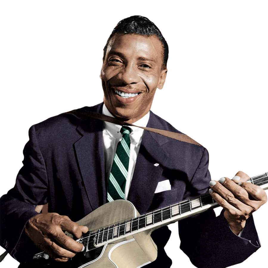 Um homem sorridente de terno segurando uma guitarra elétrica. — T Bone Walker Papéis de Parede