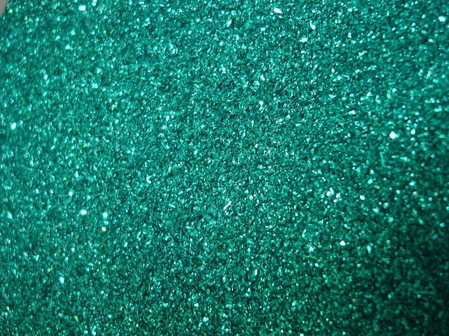 Teal glitter texture with sparkling highlights — Teal Glitter Background
