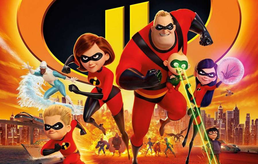 The Incredibles family in superhero costumes posing heroically over a city. — The Incredibles Wallpaper