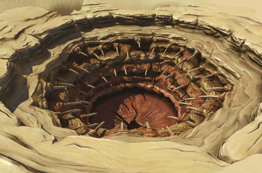 A deep hole in desert sand lined with bone-like spikes and a red interior. — The Sarlacc Pit Wallpaper
