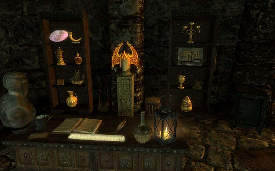 A dark stone room with a glowing skull and artifacts on a wooden desk. — Thieves Guild Wallpaper