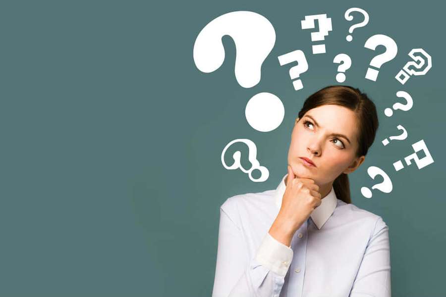 A woman in a light blue shirt looks upward with question marks floating around her head. — Thinking Background