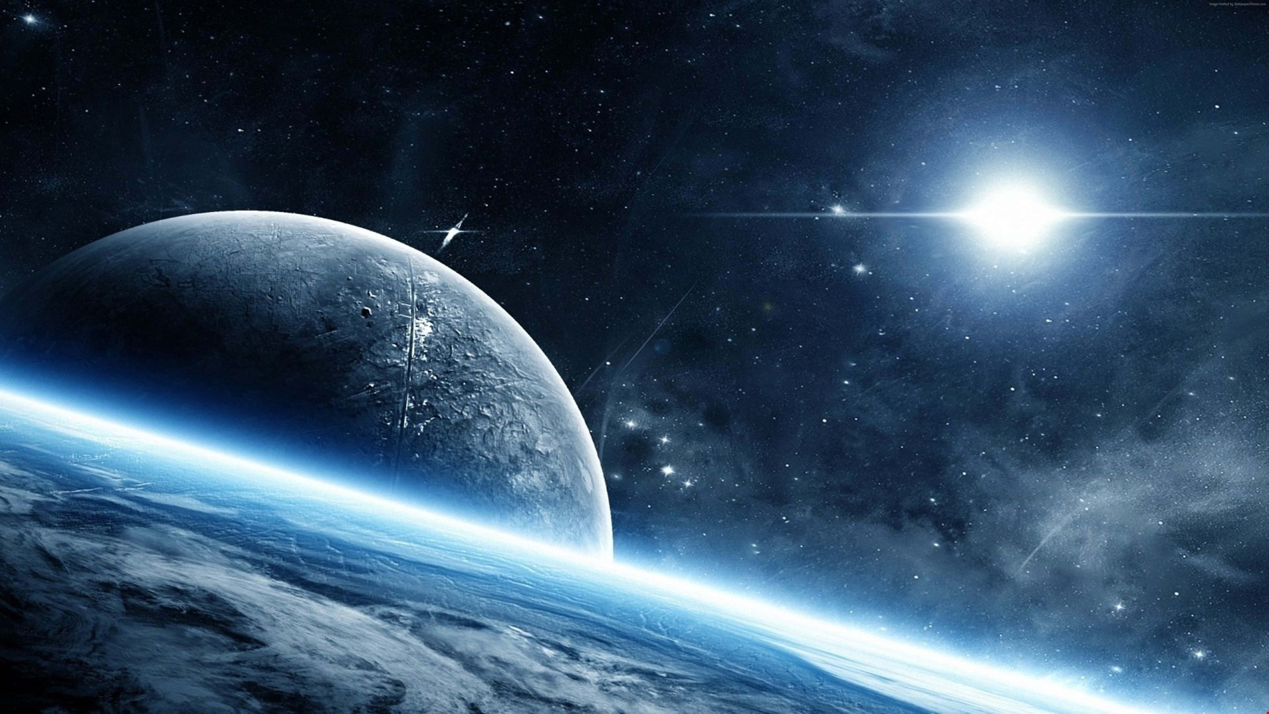 Un planeta azul y luna en el espacio con un sol brillante y estrellas — Tierra Fondos de pantalla