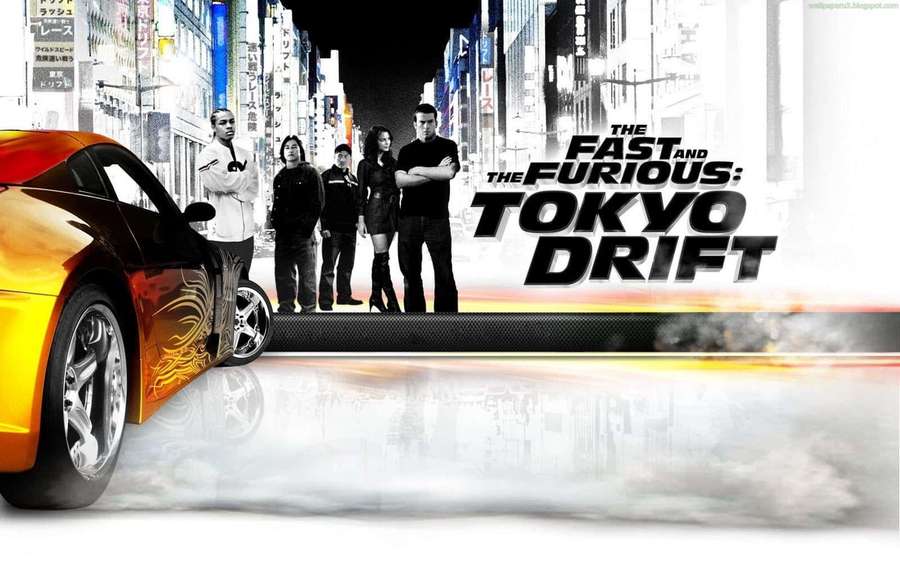 A group of drifters pose beside a flame-decaled sports car in a neon Tokyo night scene. — Tokyo Drift Wallpaper