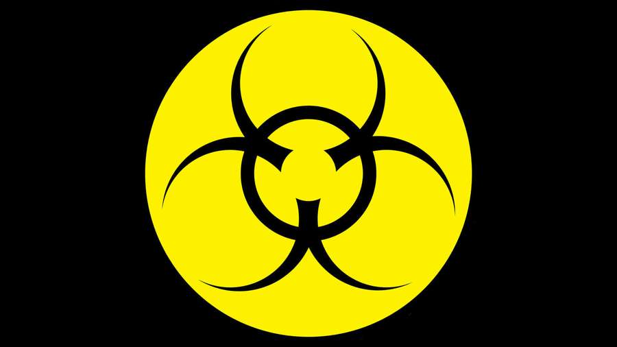 Biohazard warning symbol in yellow circle on black background — Toxic Background
