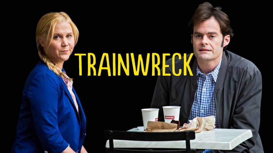 Actors at a diner table with coffee cups under 'TRAINWRECK' text. — Trainwreck Wallpaper