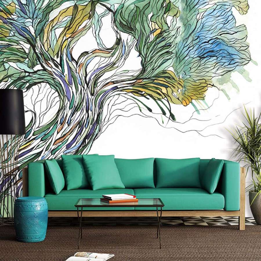 Teal sofa under colorful tree mural in modern living room with patterned rug and potted plant. — Tree Mural Wallpaper