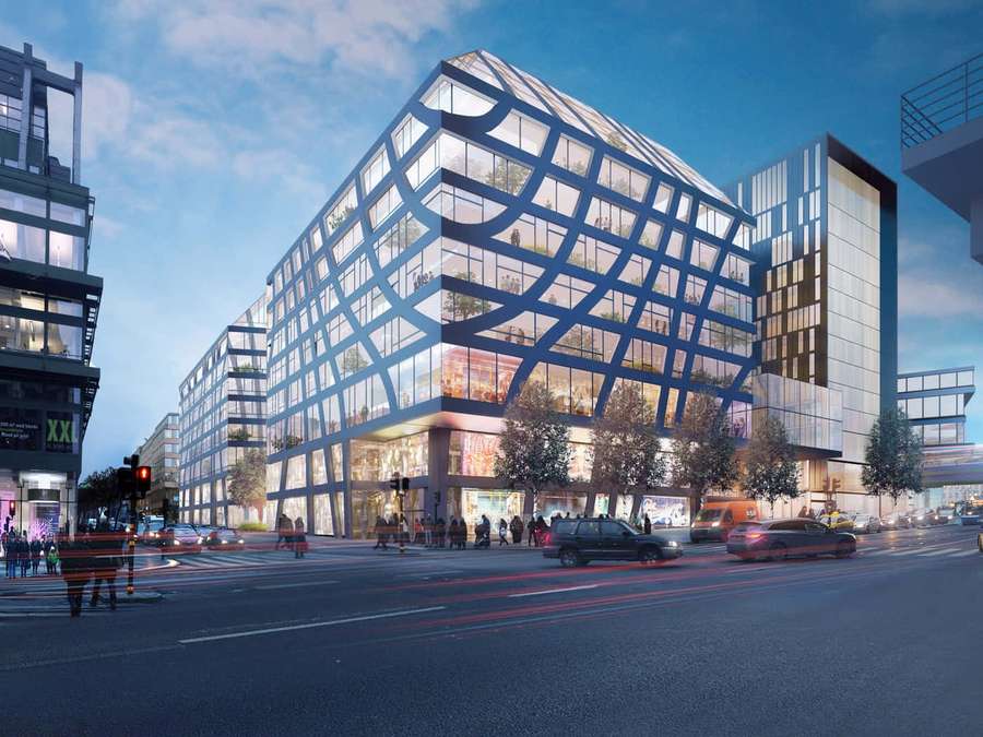Moderne glasbygning med blå bjælker ved travlt bykryds i skumringen. — Trollhättan Wallpapers