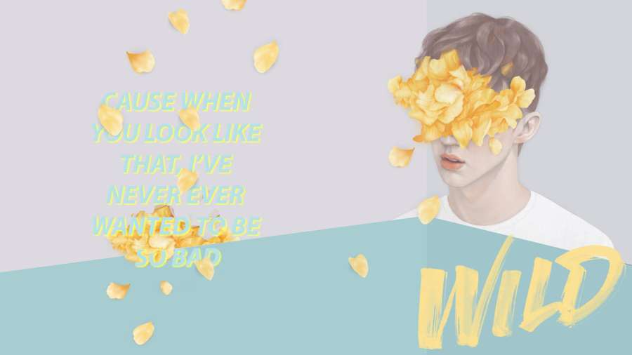 Junger Mann mit gelben Blütenblättern, die seine Augen bedecken, und Text 'cause when you look like that i've never ever wanted to be so bad wild' — Troye Wallpaper