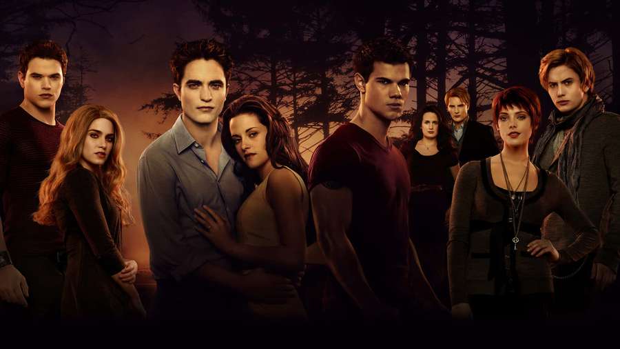 Cast of Twilight characters in a dark forest at twilight with intense expressions. — Twilight Picture