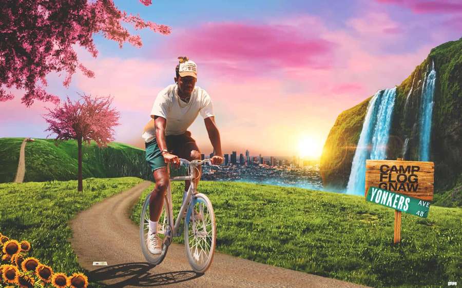Man biking on path past sunflowers cherry blossoms waterfall and city skyline at sunset. — Tyler The Creator Desktop Wallpaper