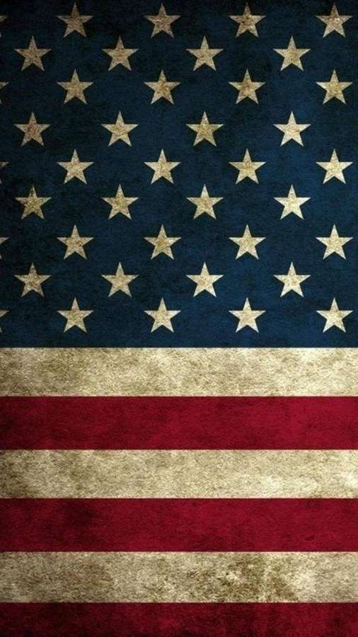 Worn American flag with faded stars and stripes showing patriotic pride. — USA Flag iPhone Wallpaper