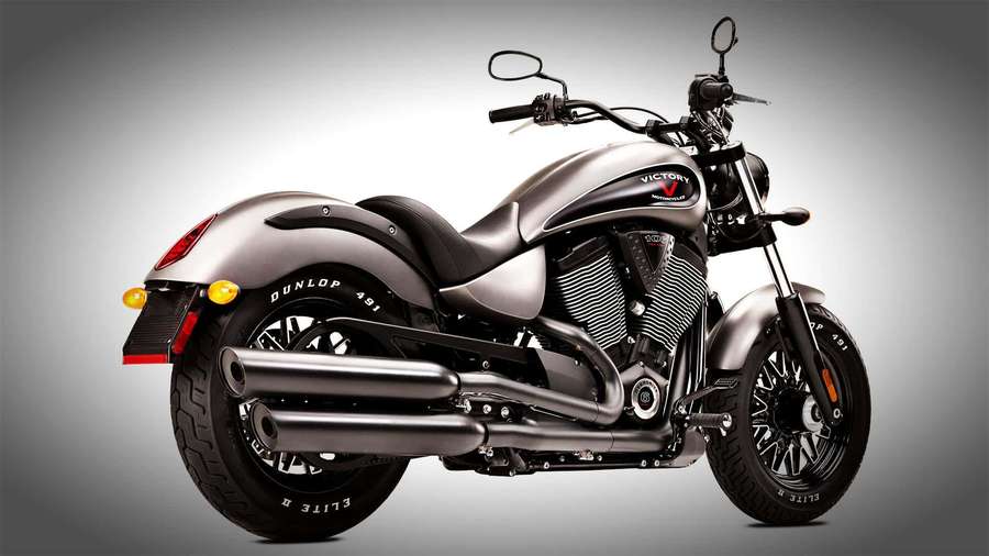 A silver motorcycle with chrome details and black tires on a gray gradient background. — Victory Motorcycle Wallpaper