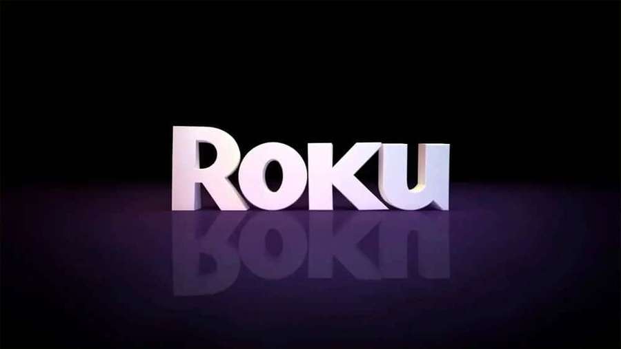 White 3D Roku logo with reflection on dark purple surface. — Video Streaming Platform Wallpaper