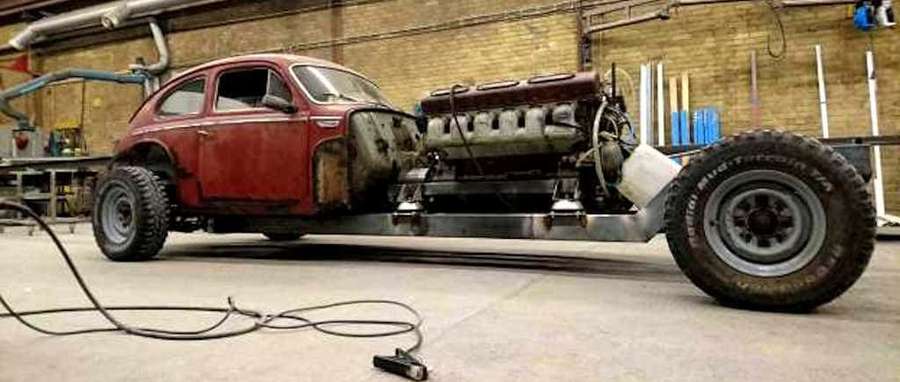 Custom red VW Beetle hotrod with V8 engine and big tires in garage. — Volvo Pv544 Wallpaper