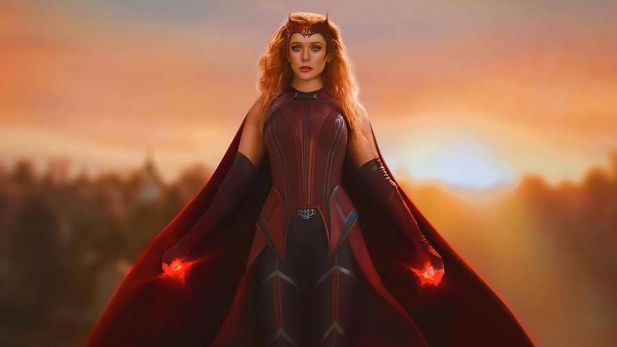 A superheroine with glowing hands stands in a red cape during sunset. — Wanda 4K Picture