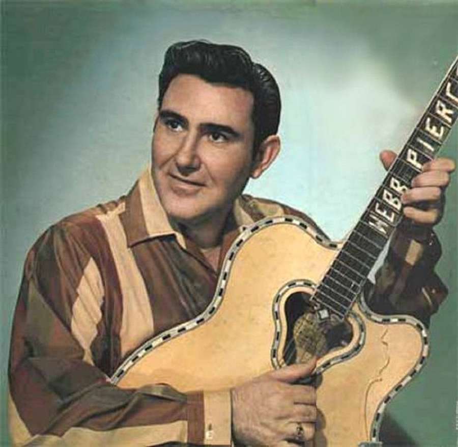 Vintage studio portrait of musician Webb Pierce holding his guitar. — Webb Pierce Wallpaper