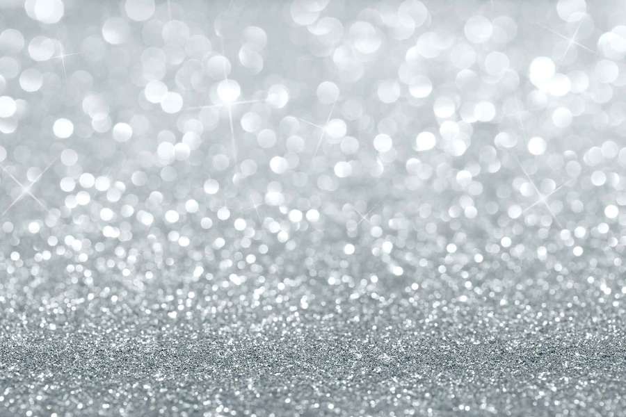 Shimmering silver glitter with soft glowing bokeh lights. — White Sparkle Background