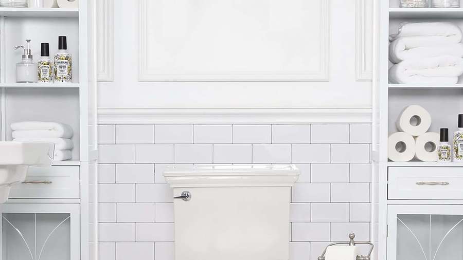 White bathroom with subway tile walls and built-in storage shelves. — White Zoom Background