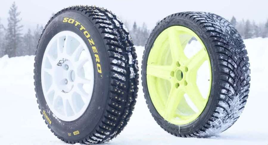 Two snow tires with white and neon yellow rims standing in snow. — Winter Tires Wallpaper