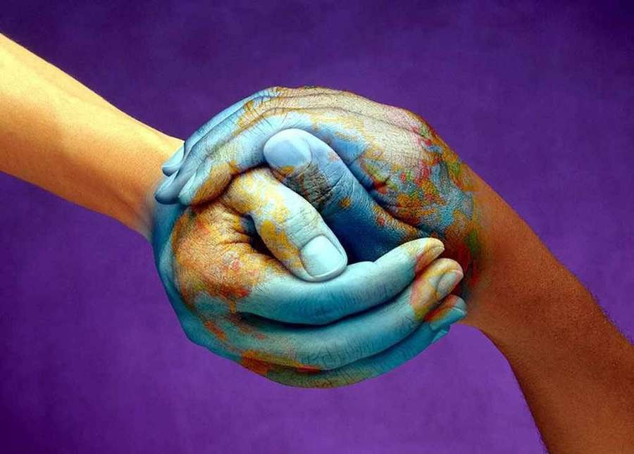 Two painted hands holding each other tightly against a purple backdrop. — World Peace Background