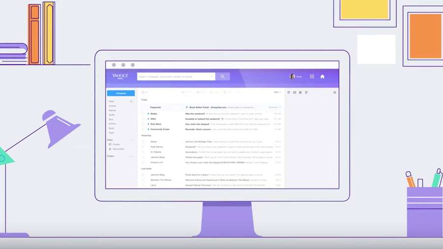 A computer screen showing Yahoo Mail inbox with office supplies around it. — Yahoo Mail Background