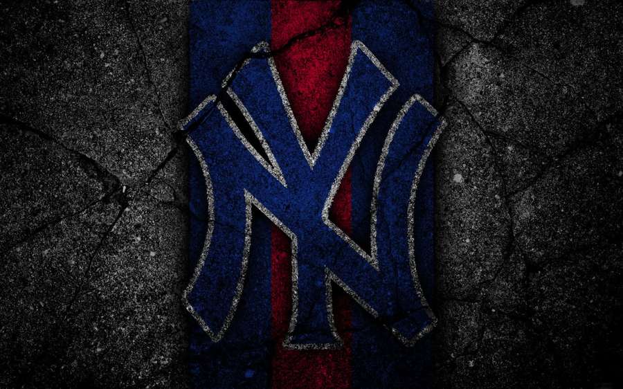 Cracked pavement with a faded New York Yankees logo in blue and red. — Yankees Background