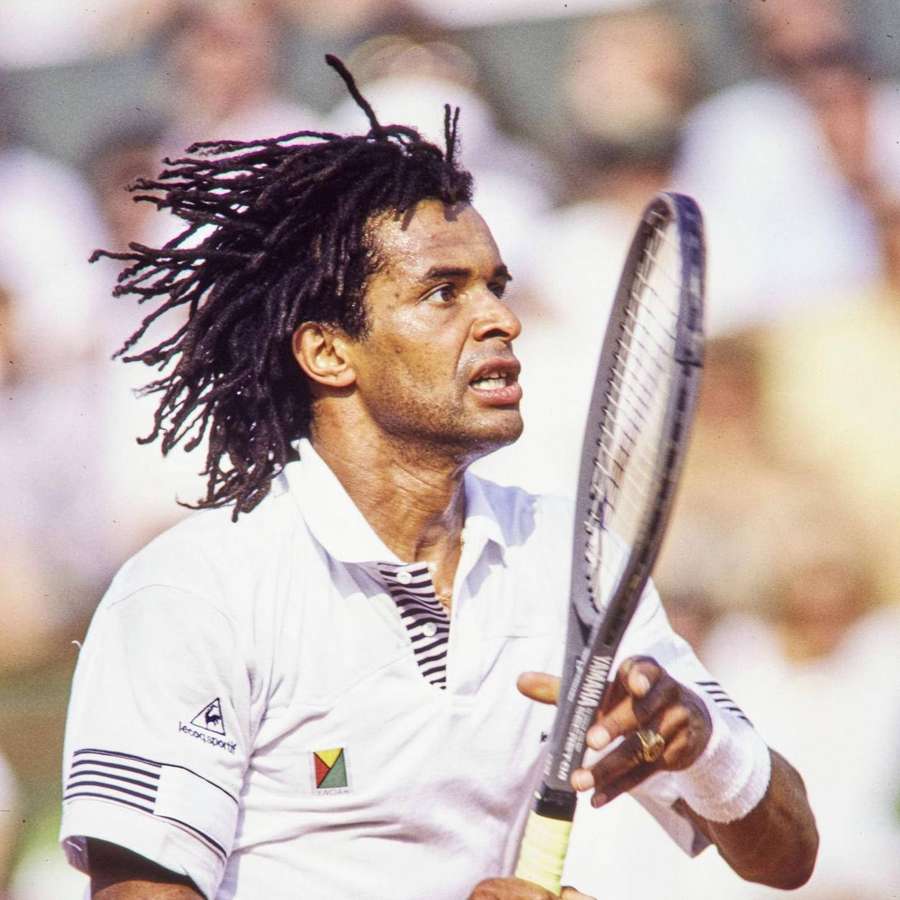 Tennis player with dreadlocks intensely focused during a match. — Yannick Noah Wallpaper