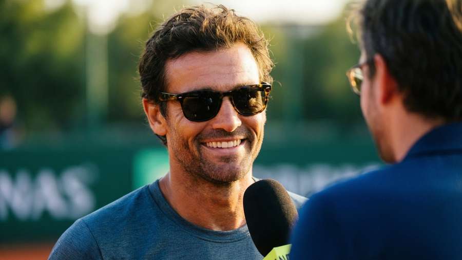 Yannick Noah smiles during a post-match interview. — Yannick Noah Picture