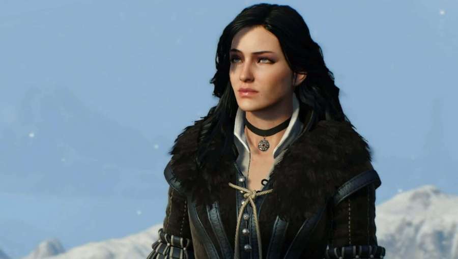 A female witcher in a fur-lined coat stands against a snowy mountain backdrop. — Yennefer Wallpaper