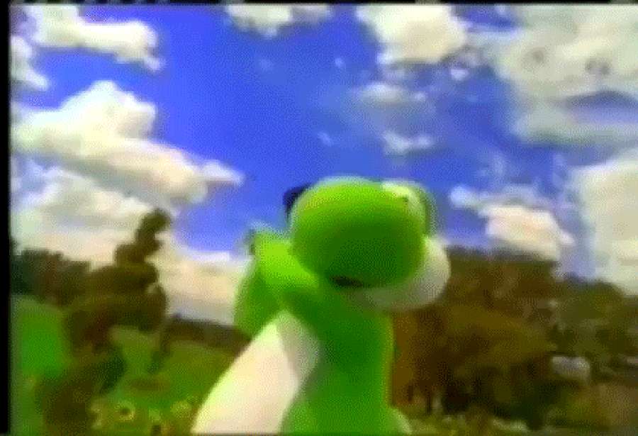 Green dinosaur character in grassy field under blue sky with clouds — Yoshi Wallpaper