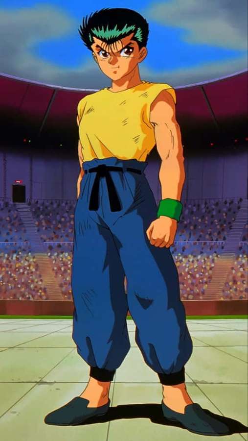Anime martial artist in yellow top and blue pants standing in stadium arena. — Yu Yu Hakusho Raizen Wallpaper